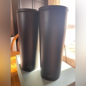 Two simple modern(SM) tall black water bottles. No straws- can’t find them.